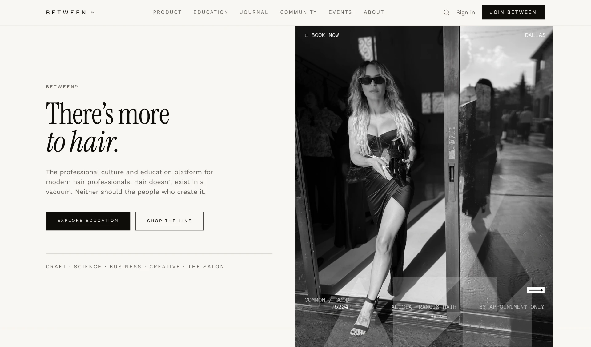 Alicia Francis Hair / BETWEEN homepage — editorial black-and-white hero with a woman standing in a salon doorway