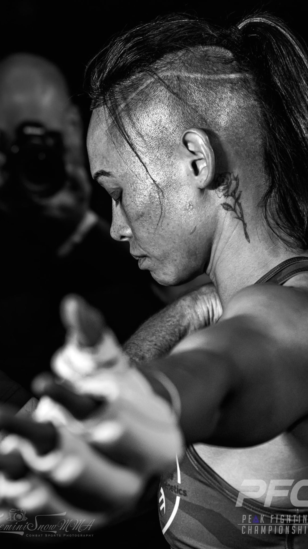 Katty Strite in a PFC fight, black and white close-up during hand wraps