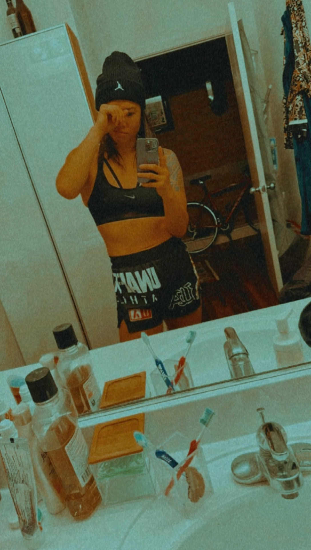 Katty Strite taking a mirror selfie in training gear